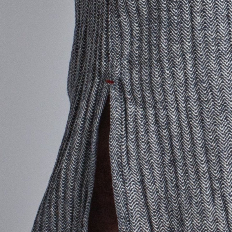 7. Close-up of side slit detail on KOOSdisain black and gray fishbone pattern dress