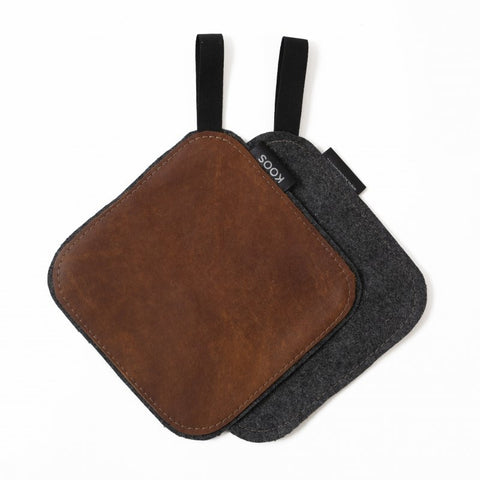 1. Brown leather pot holder with black cotton hook and wool felt backing, KOOSdisain label visible