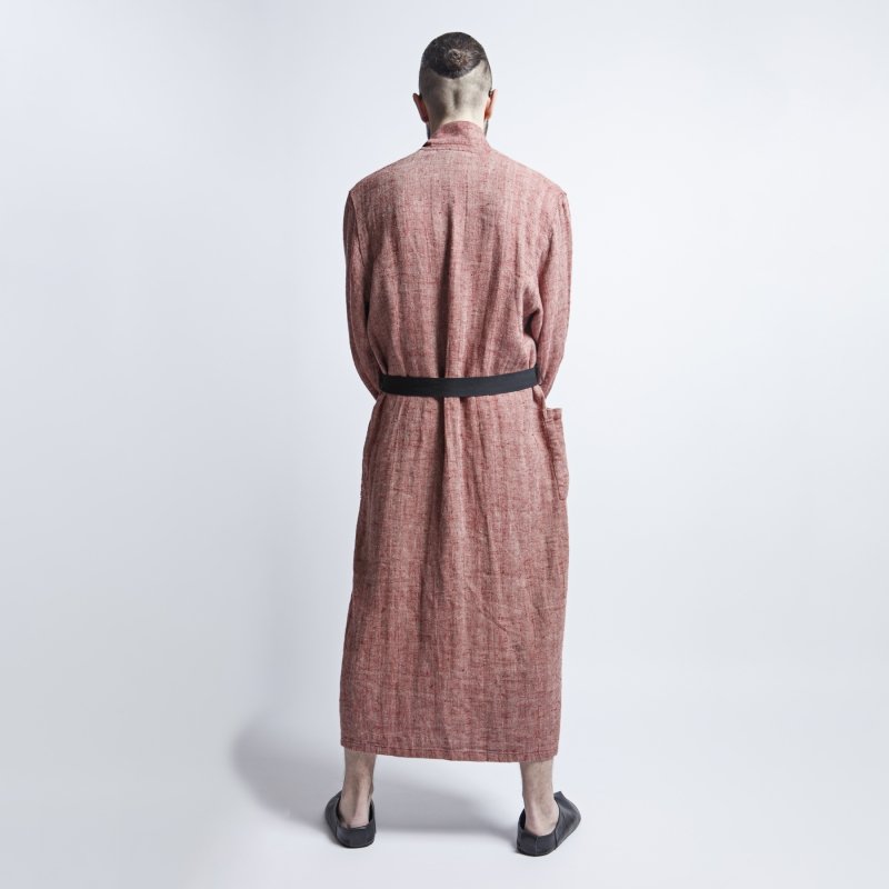 4. Back view of man in red fishbone pattern linen bathrobe with black belt, studio background