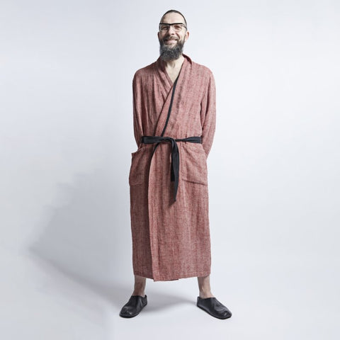 1. Man wearing red fishbone pattern linen bathrobe with black belt and pockets, standing in studio setting