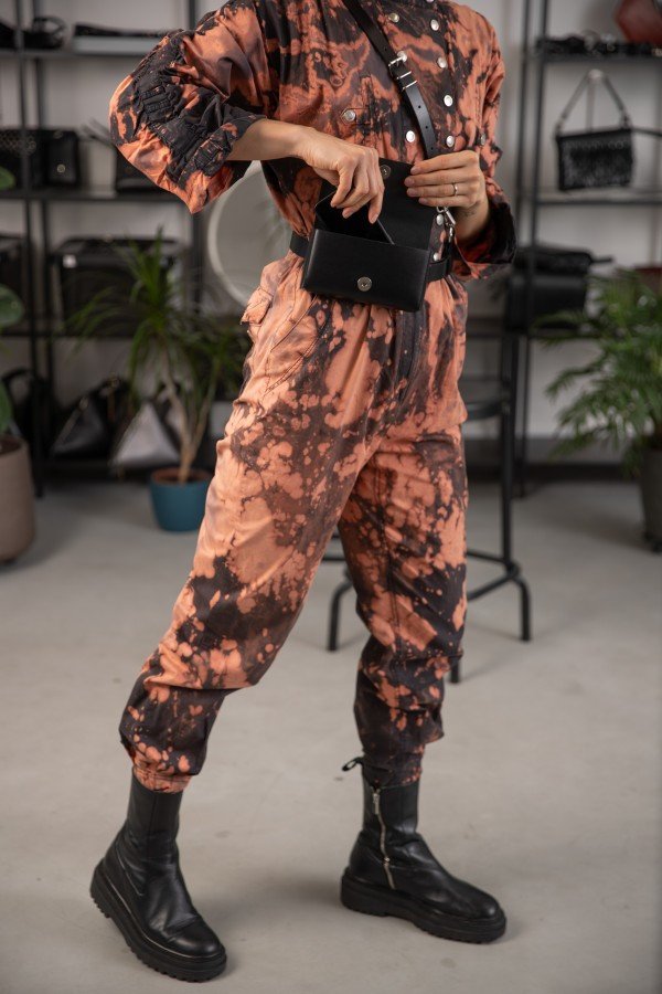 4. Unisex leather harness Kora No2 by PYKOK styled with black boots, shown on model in studio