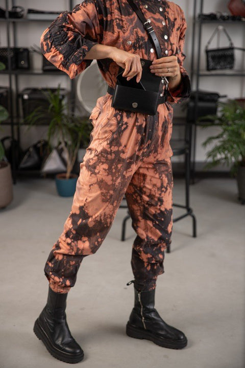 4. Unisex leather harness Kora No2 by PYKOK styled with black boots, shown on model in studio