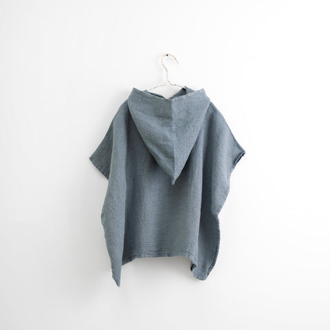 2. Back view of kids' blue fog linen poncho with hood on white background, highlighting waffle weave