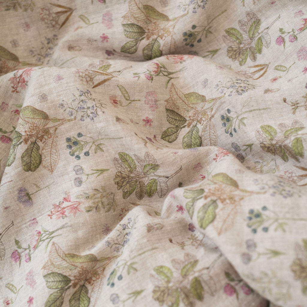 3. Close-up of botanical print on kids' linen duvet cover fabric, showing floral details