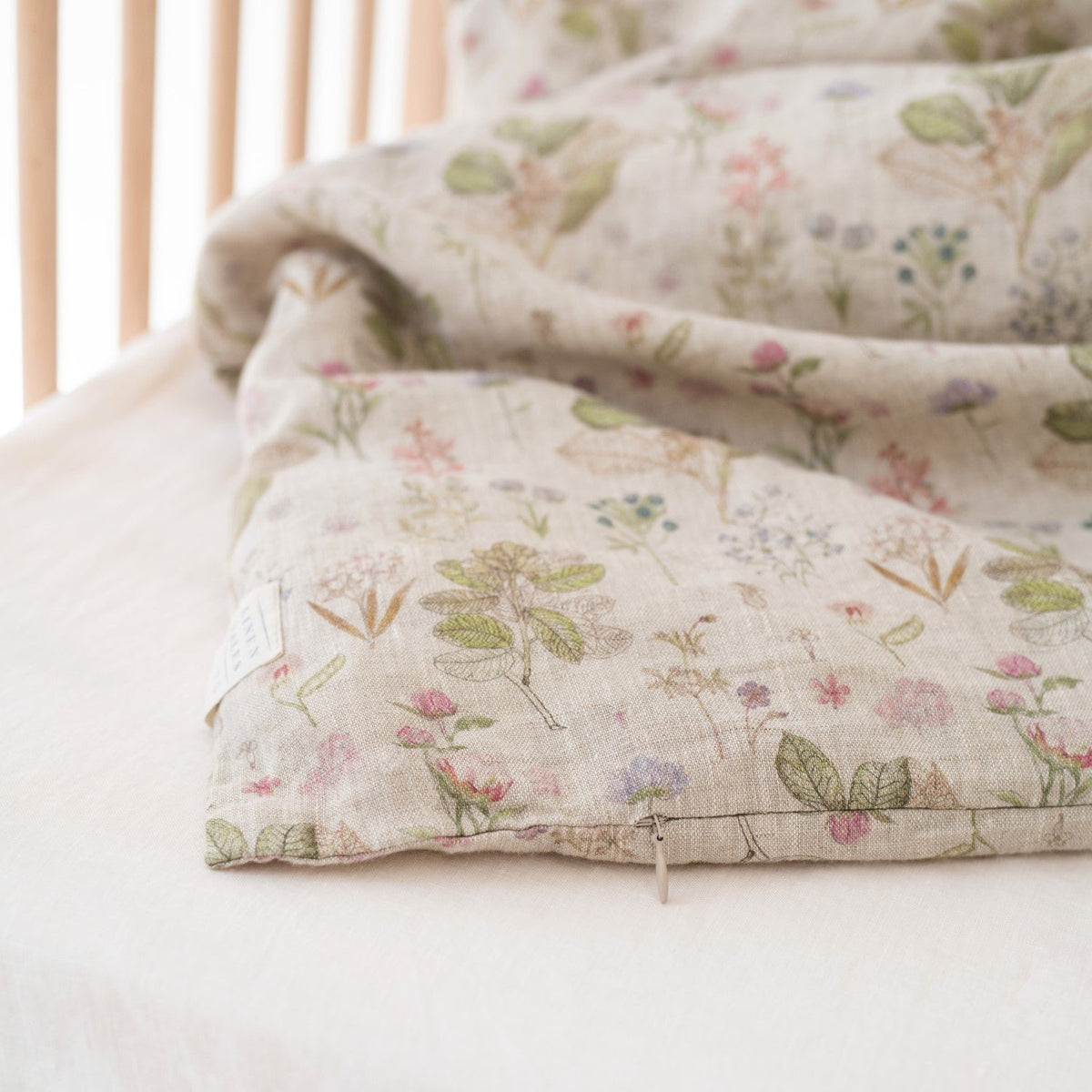 3. Detail of zipper closure on botanical print linen duvet cover for kids