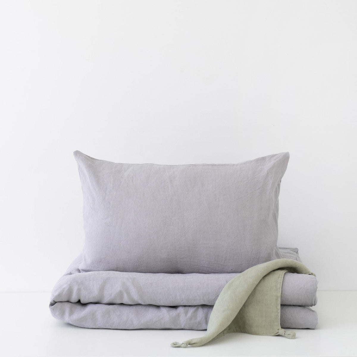 2. Light grey linen duvet cover set with pillowcase on white background, showcasing soft texture and minimalist design