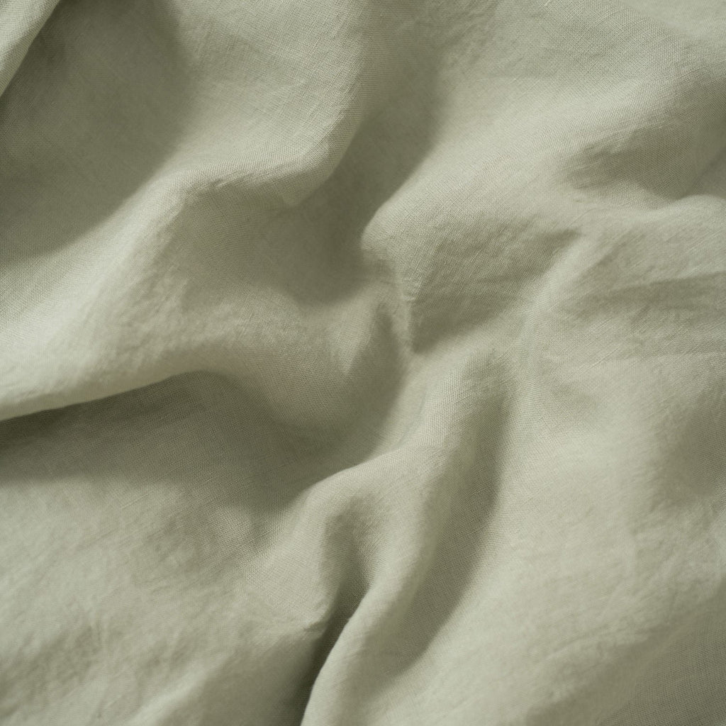 3. Close-up of sage green linen fabric showing texture and softness