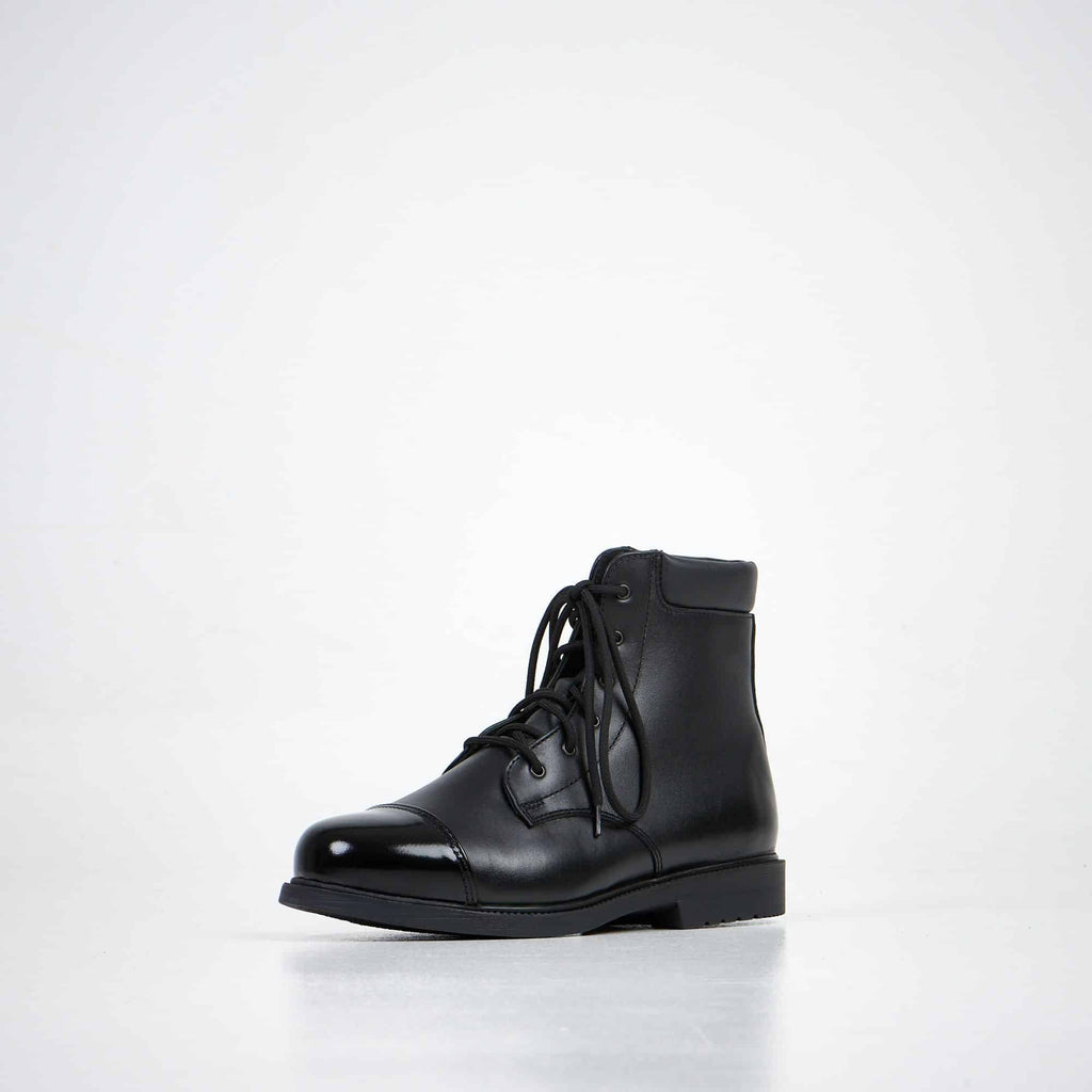 4. Unisex black leather ankle boots by Samelin, front angle view in studio