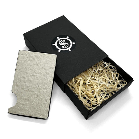 2. Kohev Lumi card holder with natural slate finish next to black Seif Design box with eco-friendly packaging