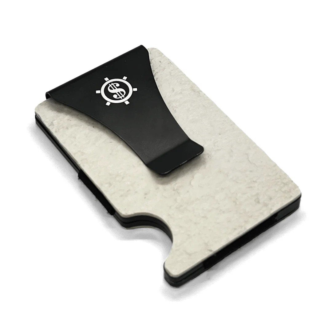 1. Kohev Lumi card holder with black money clip and Seif Design logo on natural slate surface