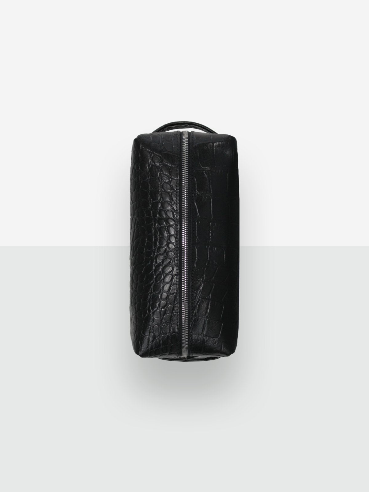 1. Black Croco VESUVIUS cosmetic bag by Lava flow, side view showing zippered closure and croc-embossed leather texture