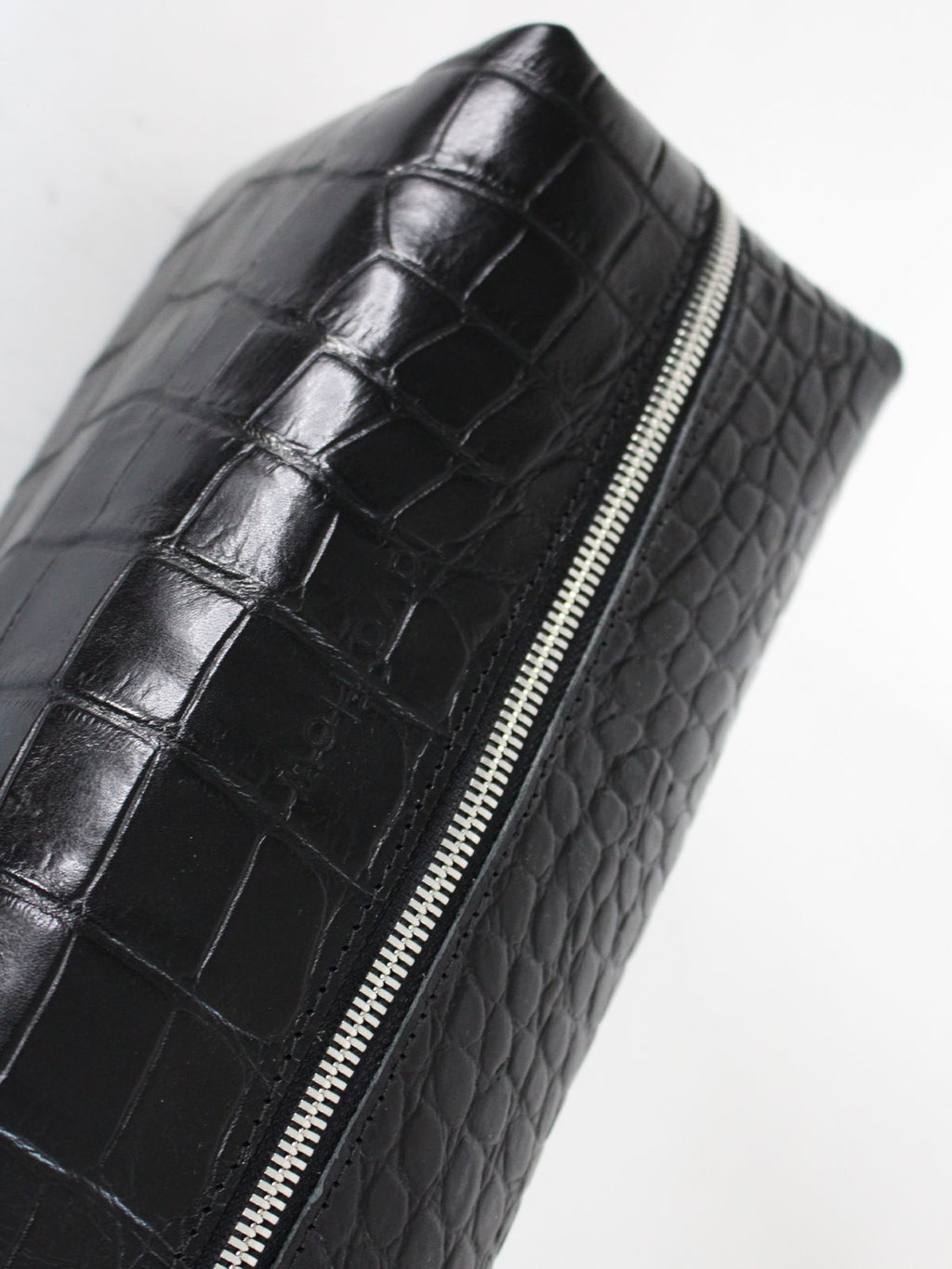 3. Close-up of Black Croco VESUVIUS cosmetic bag by Lava flow, showcasing croc-embossed leather and secure zipper