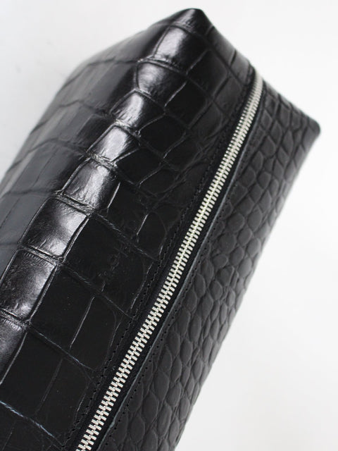 3. Close-up of Black Croco VESUVIUS cosmetic bag by Lava flow, showcasing croc-embossed leather and secure zipper