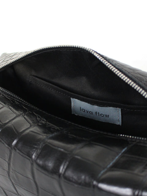 2. Interior view of Lava flow VESUVIUS cosmetic bag in Black Croco, highlighting brand label and cotton lining