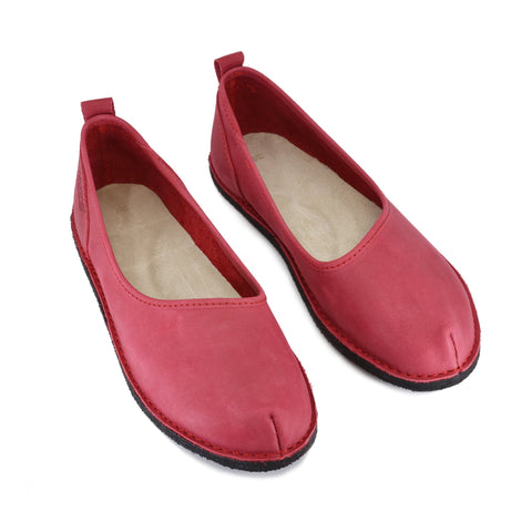 2. Pair of women's Kuutsid Shoes in red, top view showing ergonomic design and suede-covered insole