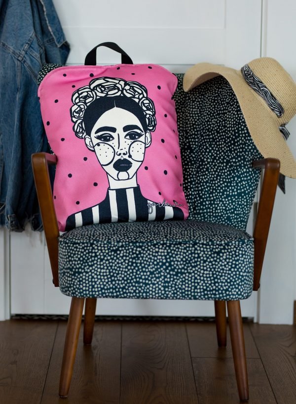 5. Pink MARGO backpack by Garbanota with artistic print, styled on chair with hat and jacket