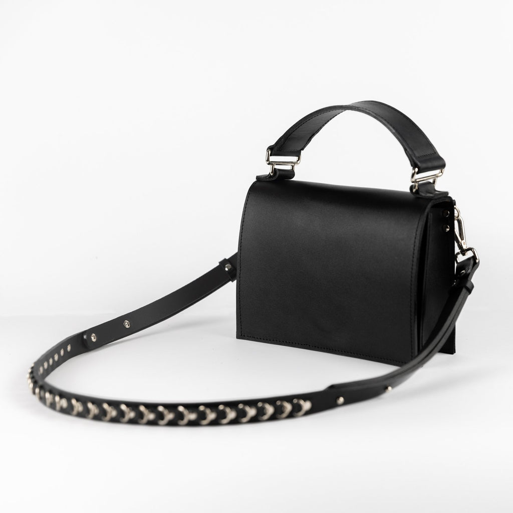 1. PYKOK Lila Mini handmade leather handbag with adjustable strap, shown in studio setting