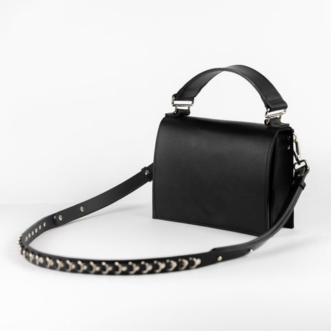 1. PYKOK Lila Mini handmade leather handbag with adjustable strap, shown in studio setting