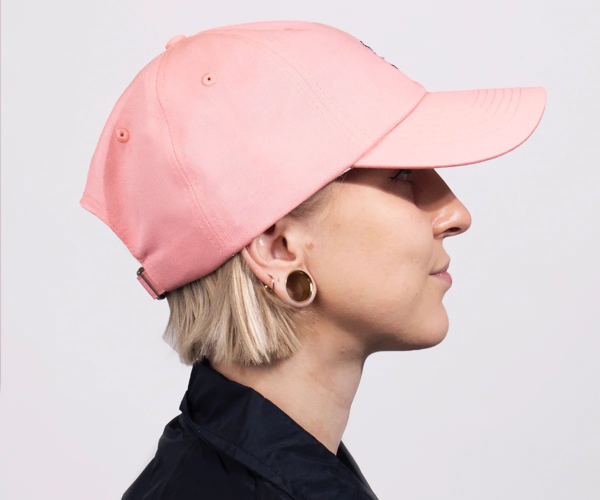 3. Side view of women's pink Little My cap by Moomin, worn by model