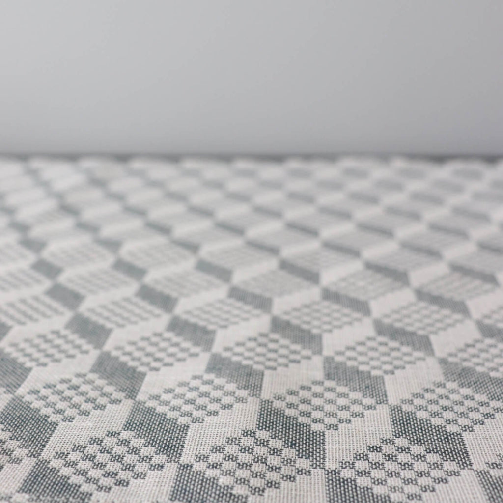 3. Close-up of Virumaa folk art pattern on grey and white table runner