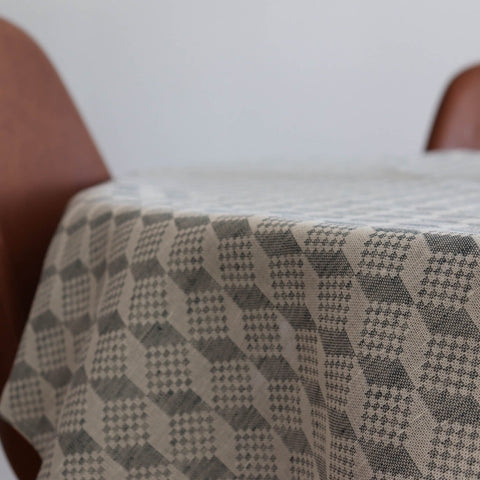 2. Close-up of LOKO Virumaa tablecloth showing detailed geometric pattern in linen-cotton blend on table edge