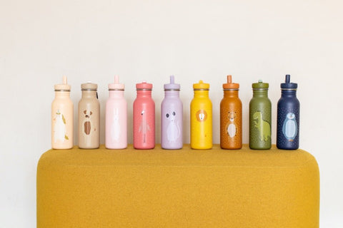 1. Row of colorful stainless steel bottles with animal designs on yellow surface