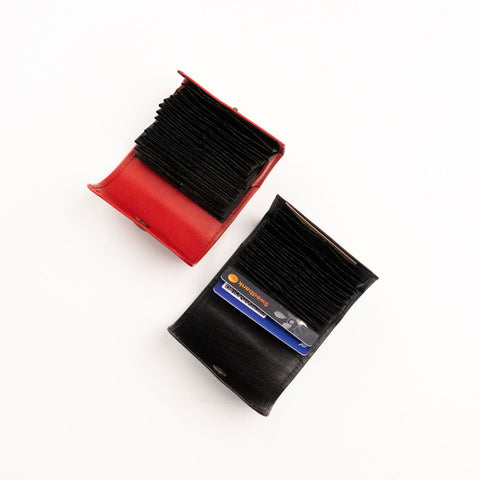 3. Studio shot of Papillon leather card holders in red and black, highlighting compact design and card capacity