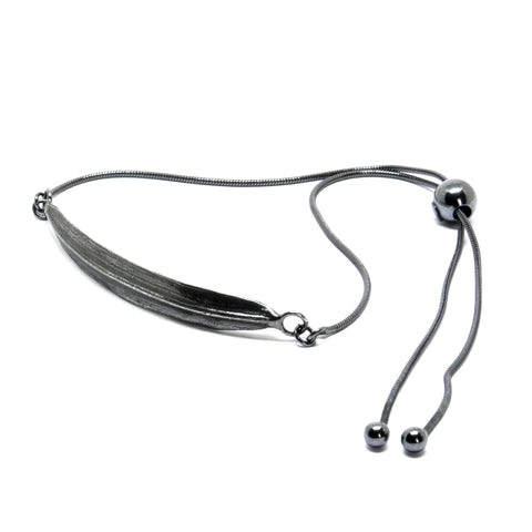 2. Dark-toned SPRING Leaf bracelet by Agnes Veski Jewellery, featuring adjustable chain and leaf motif in studio setting