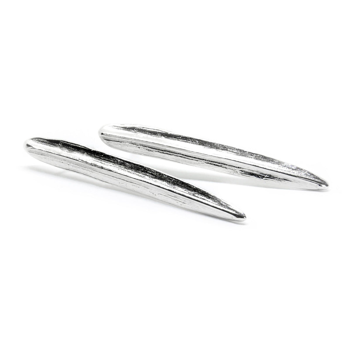 2. Agnes Veski Jewellery SPRING Leaf earrings in silver plating, displayed in a studio setting