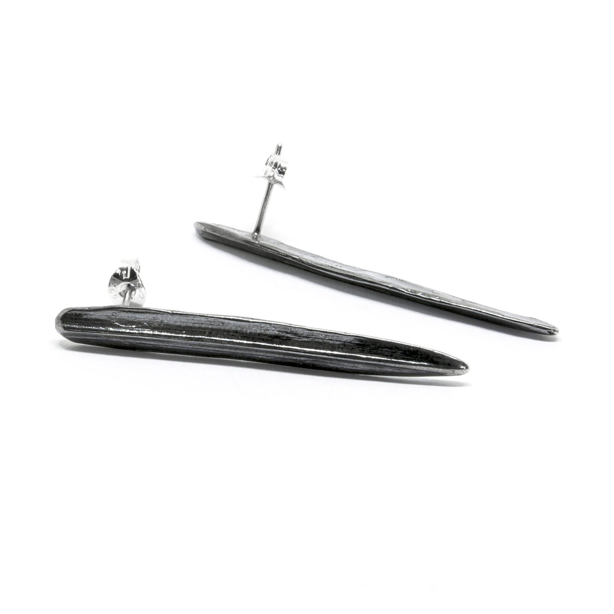 1. Agnes Veski Jewellery SPRING Leaf earrings in oxide plating, shown in a studio setting