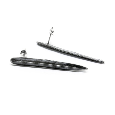 1. Agnes Veski Jewellery SPRING Leaf earrings in oxide plating, shown in a studio setting