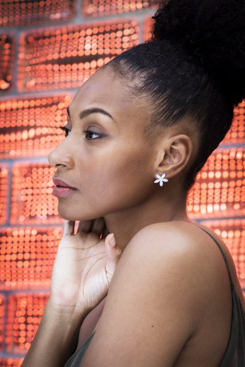 3. Side profile of woman wearing Lentsius Lilac Upcycled Earrings, emphasizing polished stainless steel finish