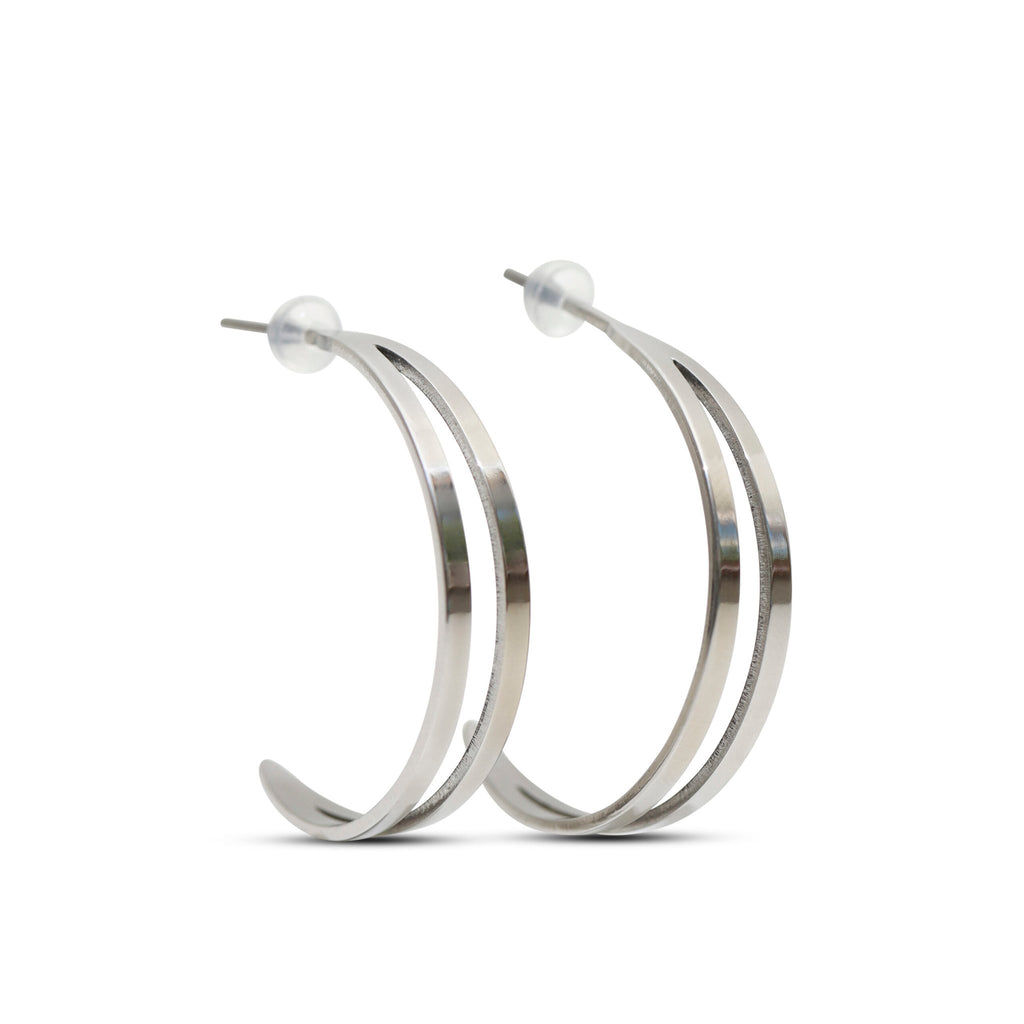 4. Studio shot of Lentsius Linea earrings, featuring polished stainless steel and silicone stoppers for comfort