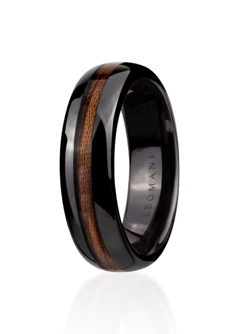 2. Black ceramic men's ring with natural veneer stripe by Leomani, shown in studio lighting highlighting sleek design