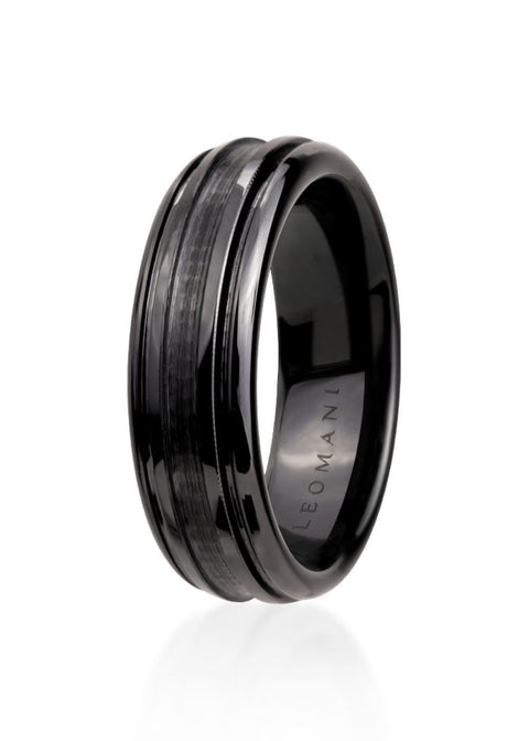 2. Men's black ceramic ring by Leomani with modern design, featuring a smooth finish and subtle grooves, shown in studio lighting highlighting its sleek and durable construction