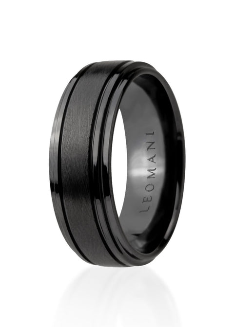 2. Men's black ceramic ring by Leomani with a sleek modern design, shown in studio lighting highlighting its smooth finish