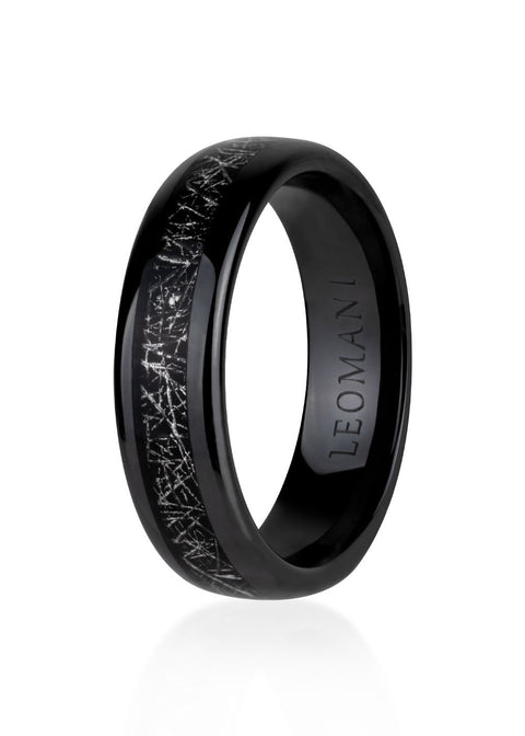 2. Men's black ceramic ring by Leomani featuring intricate silver pattern on band, shown in studio lighting highlighting glossy finish and brand engraving inside