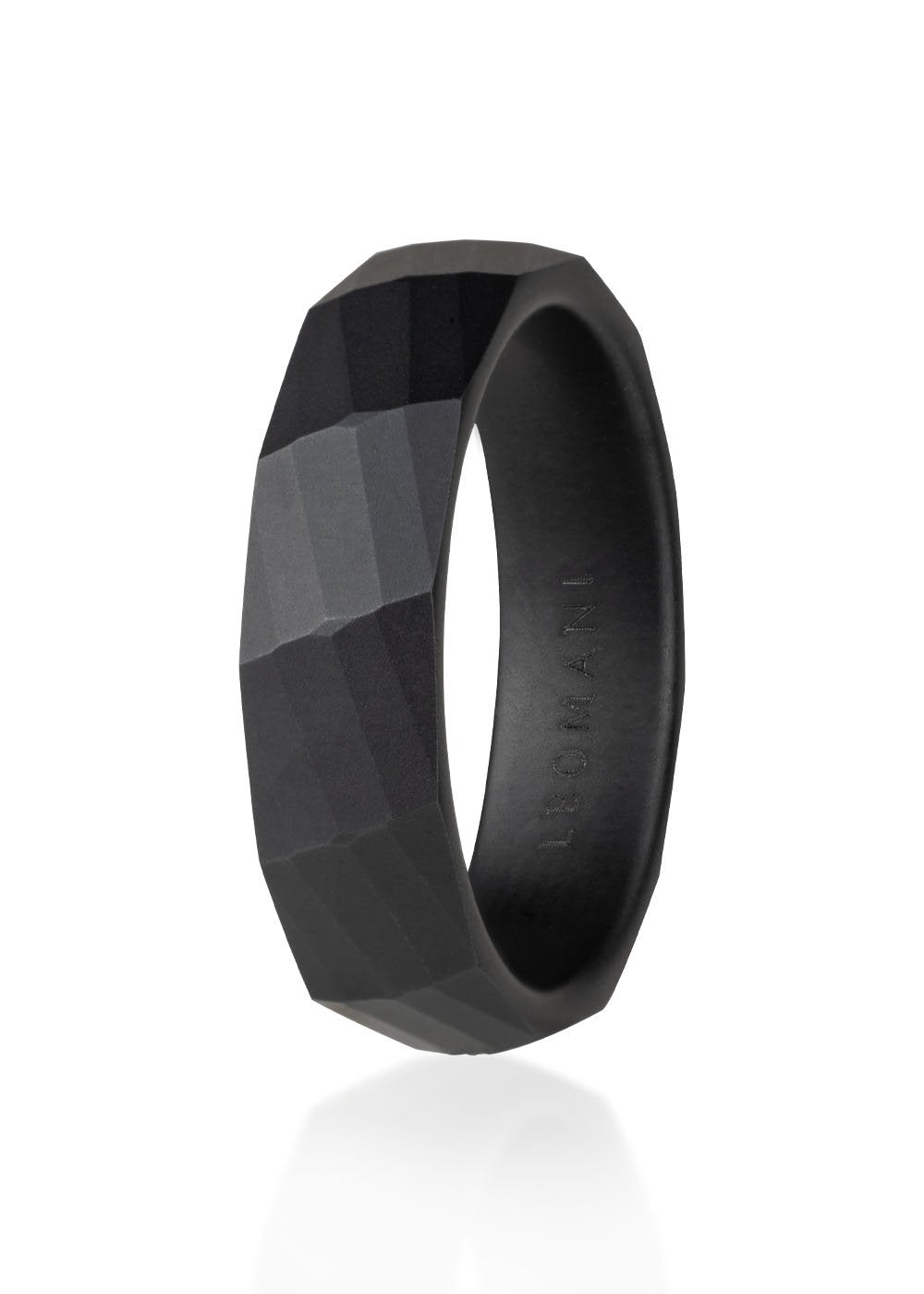 2. Men's black ceramic ring by Leomani with faceted pattern, shown in studio lighting highlighting its modern design and durable material