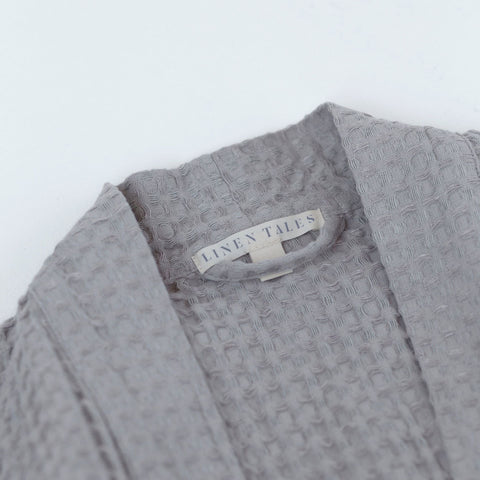 3. Close-up of Linen Tales label on light grey honeycomb waffle fabric