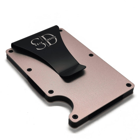 2. Angled view of Seif Design pink cardholder with black clip, highlighting minimalist design and RFID blocking feature