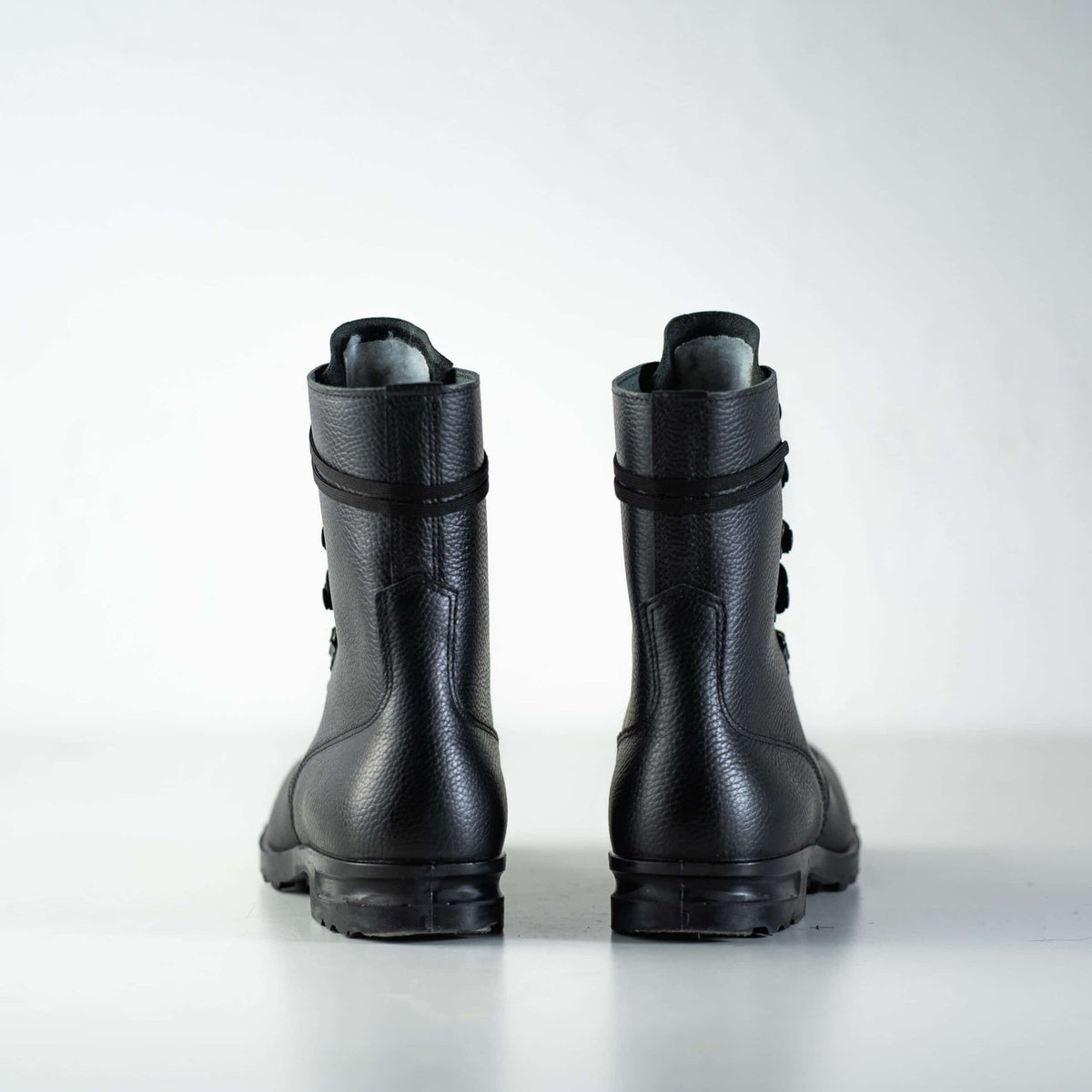 5. Back view of M77 Norwegian Combat Boots by Samelin in black leather, studio setting