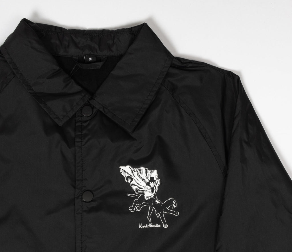 9. Studio shot of unisex black Coach Jacket The Hobgoblin by Moomin highlighting front logo