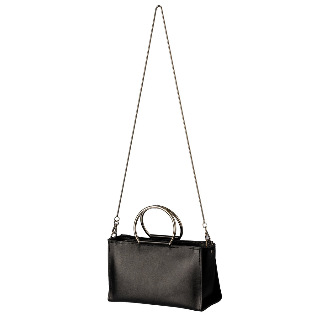 5. PYKOK Handbag Maria Mini in black leather with long chain strap, studio setting