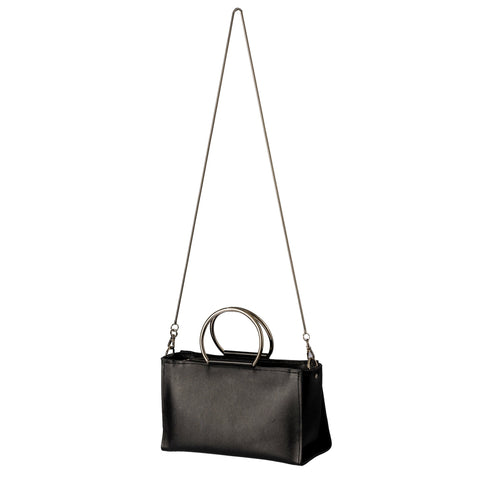 5. PYKOK Handbag Maria Mini in black leather with long chain strap, studio setting