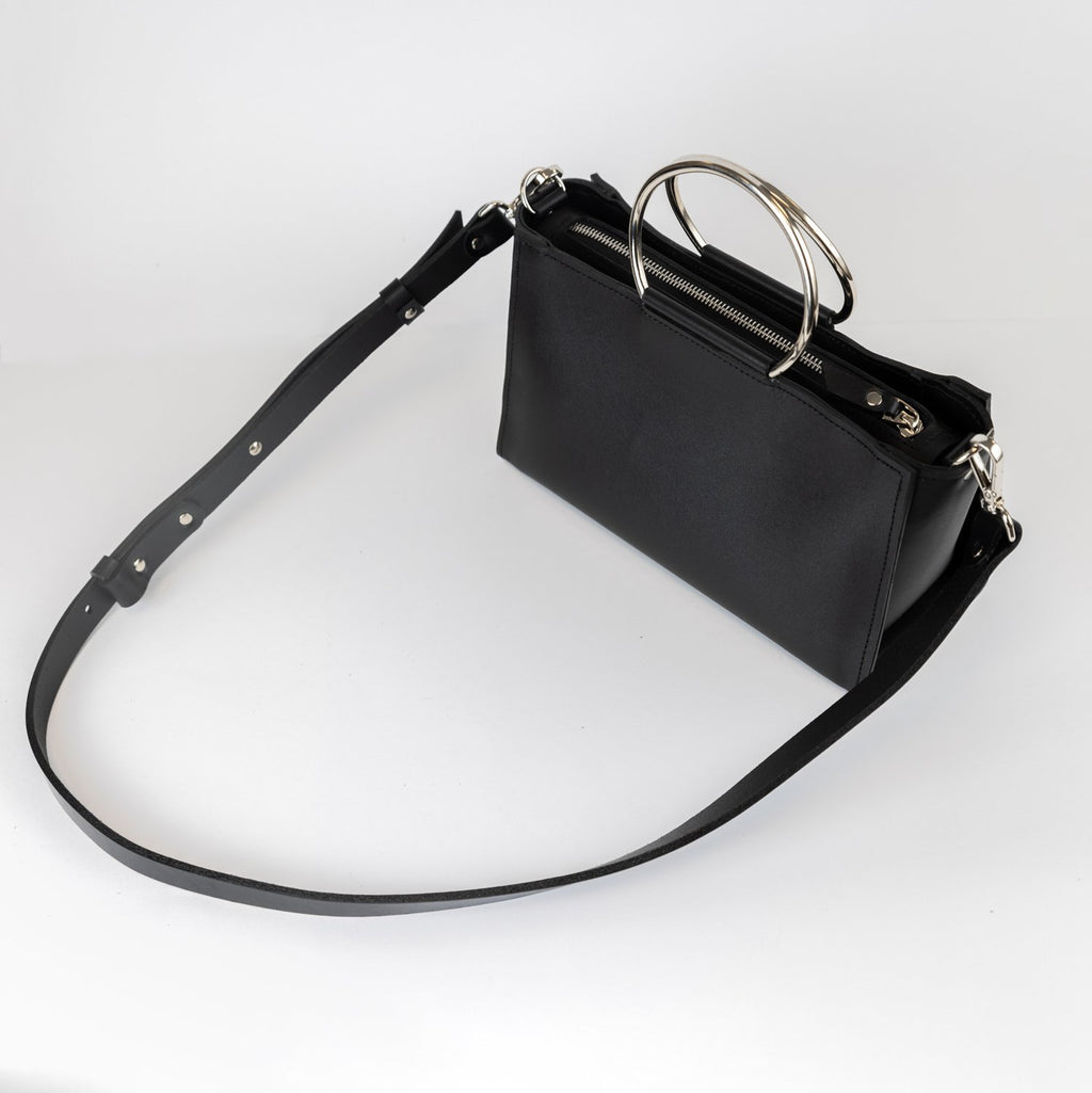8. Black leather Handbag Maria Mini by PYKOK with adjustable strap, studio view