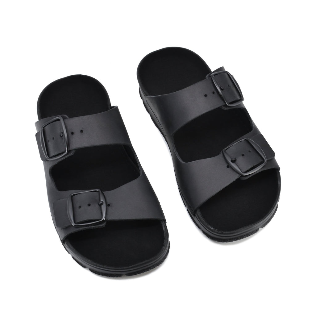5. Top view of Meeliku black sandals by Omaking, highlighting natural leather and buckle design