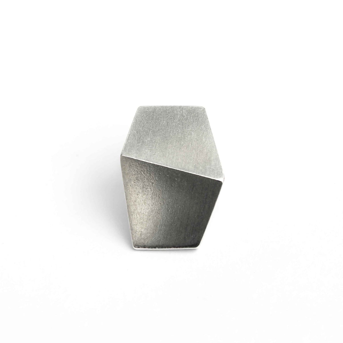1. Men's sterling silver MENellery pin by Lisa Kroeber Jewellery, showcasing a modern geometric design in a studio setting