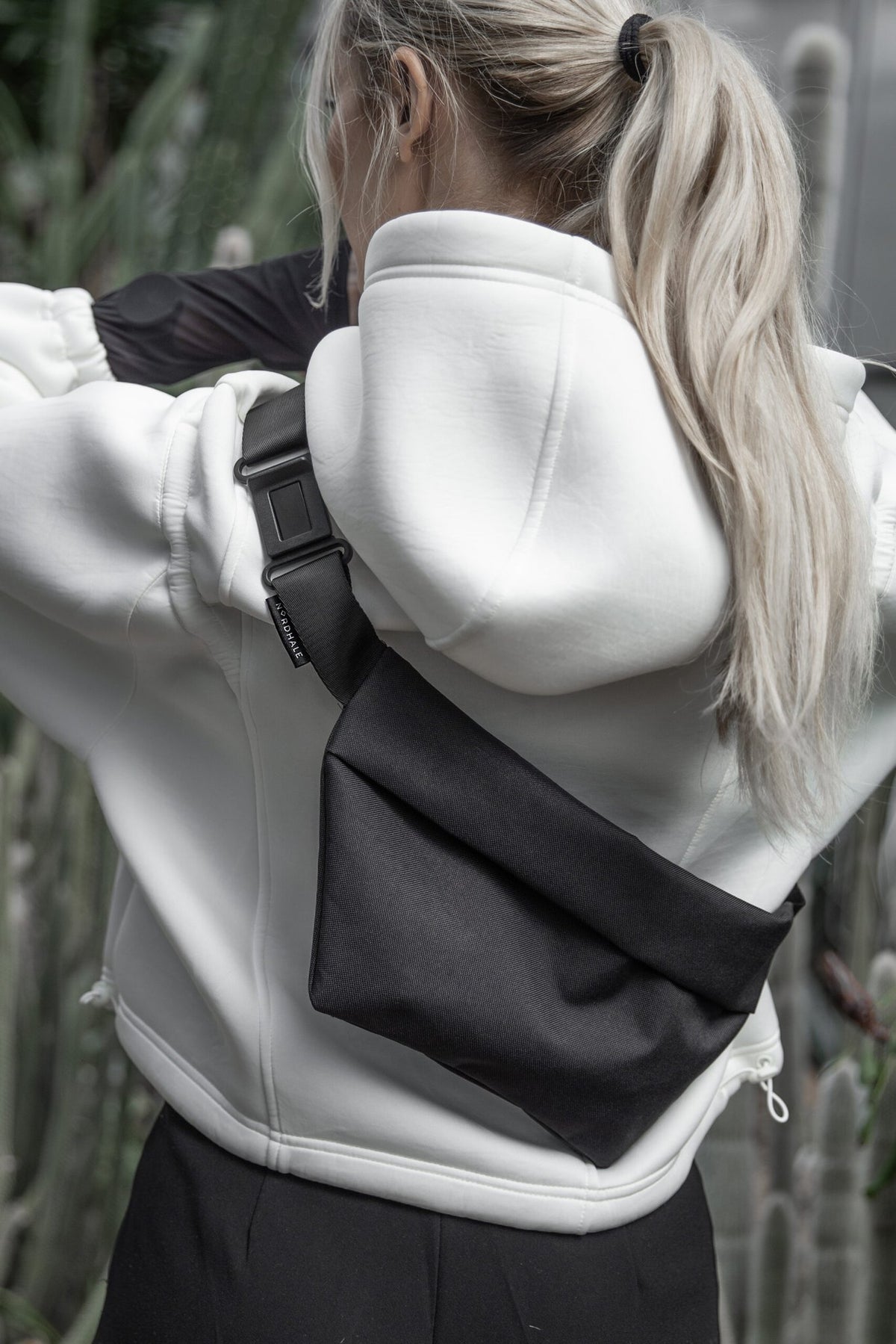 8. Studio shot of Nordhale OSLO Cross Body Bag in black, showing strap and buckle detail