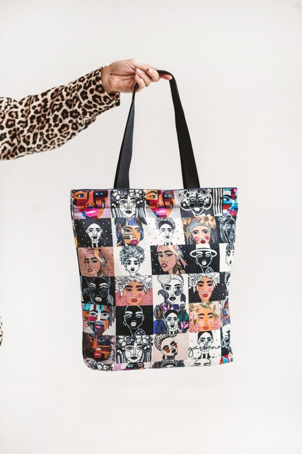 3. Studio shot of Garbanota handbag mosaic colored, featuring artistic graphic design and black handles