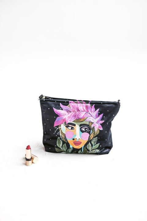 1. Garbanota makeup bag in Forest Berry design held by a woman, showcasing artistic print and versatile size